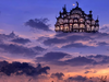 Beautifully elaborate building under a twilight sky.png