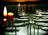 Lake at night illuminated by many candles.png