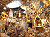 Surreal and ornate shrine covered in golden offerings and incense.png